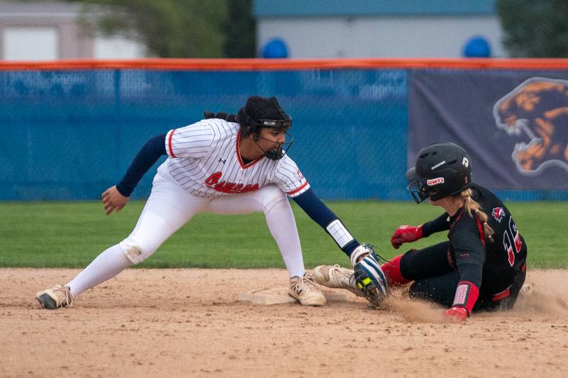 Yorkville's Lillian Myers (right) beats the tag by Oswego’s Jaelynn Anthony on a steal attempt during a softball game at Oswego High School on Tuesday, April 25, 2023.