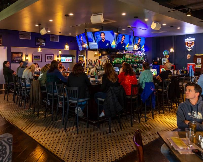 Patrons watch the NFL Draft at Max in McCook.  April 25, 2024.