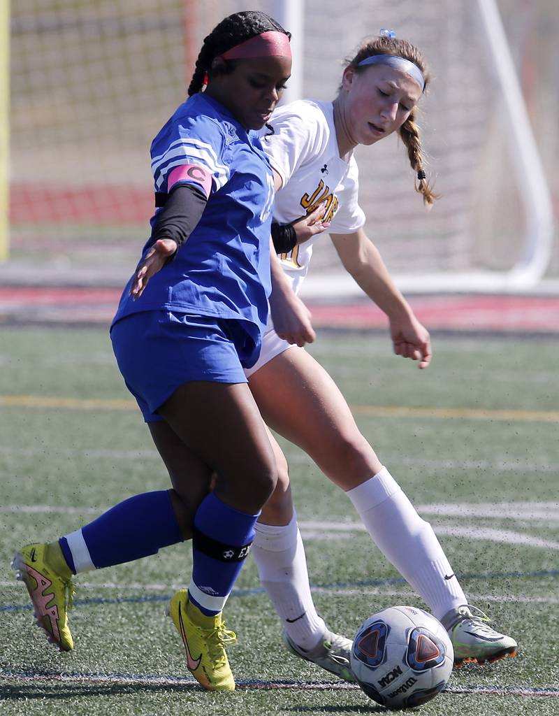 Larkin’s Jateme Owens tries to take the ball from Jacobs' Gabby Wojtarowicz during a nonconference Huntley Invite girls soccer match Tuesday, March 28, 2023, at Huntley High School.