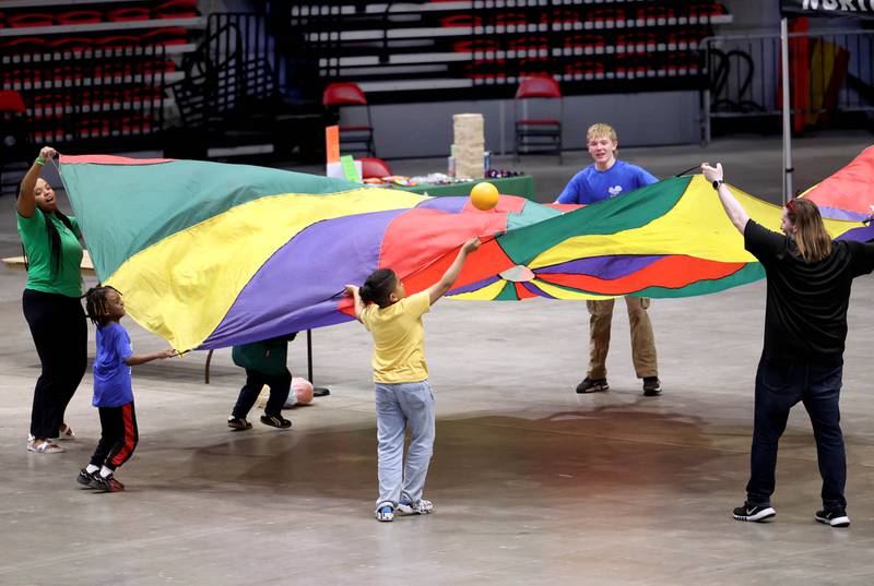 Younger visitors play at the Kids Camp Thursday, April 24, 2025, during the Local Showcase and Spring Show in the Convocation Center at Northern Illinois University in DeKalb.