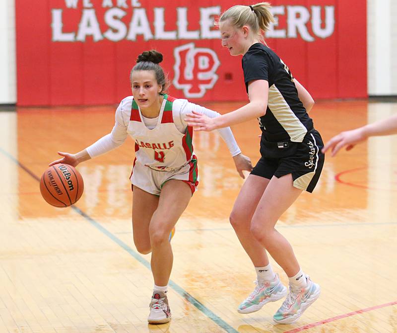 L-P's Brooklyn Ficek dribbles around Sycamore's Lexi Carlsen on Tuesday, Jan. 31, 2023 at L-P High School.