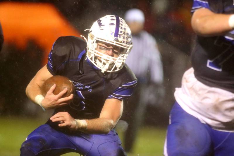 Burlington Central’s Tyler McGladdery moves with the ball against Harlem in IHSA football Class 6A second-round playoff action at Central High School in Burlington on Saturday, November 8, 2025.