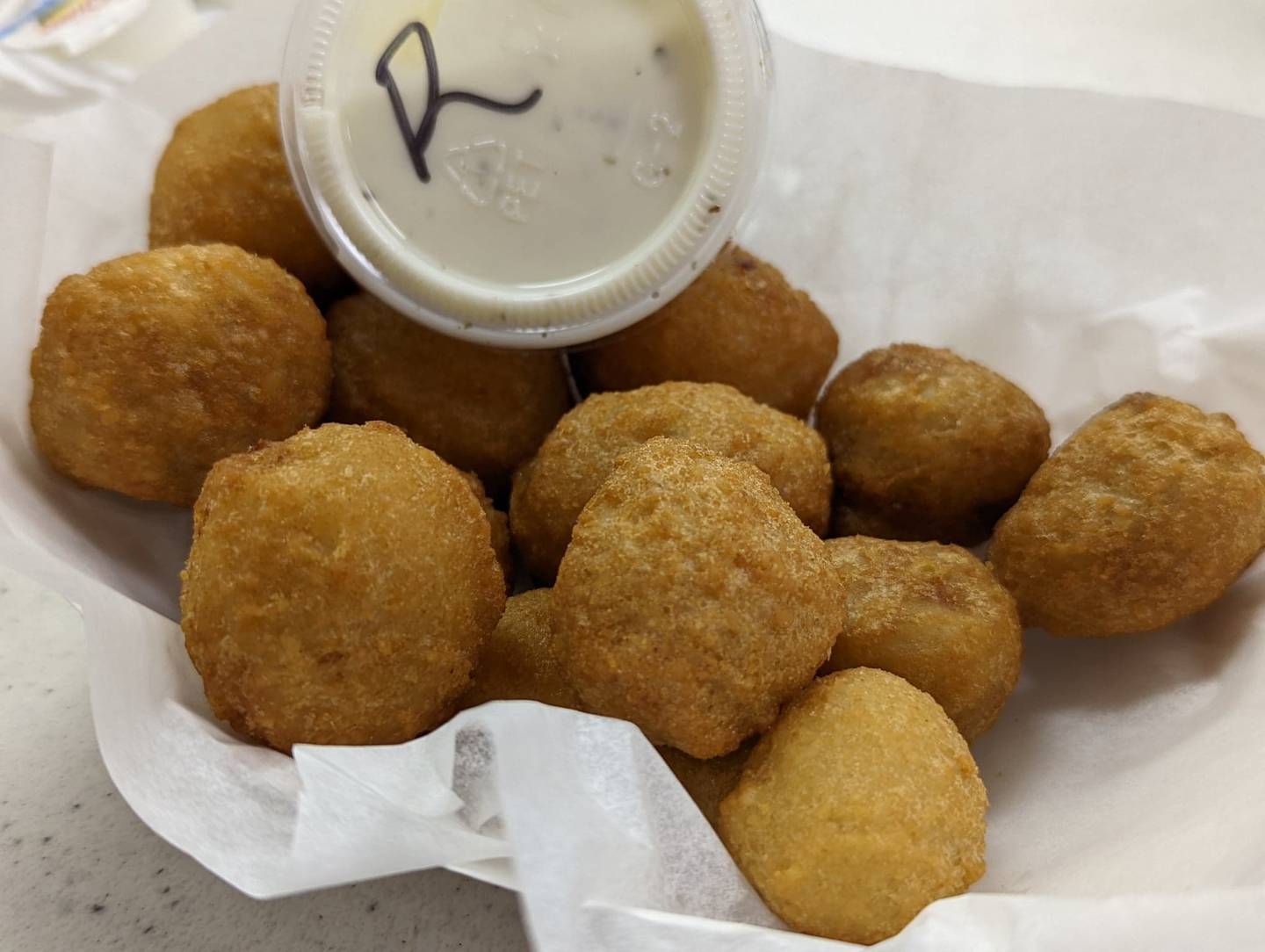 The Knights of Columbus Holy Trinity Council No. 4400 on Joliet's East side offer a choice of four different appetizers at its fish fries, all for $7.95 each: mozzarella sticks with marinara sauce, onion Rings, fried mushrooms and macaroni and cheese bites. Pictured are the fried mushrooms.