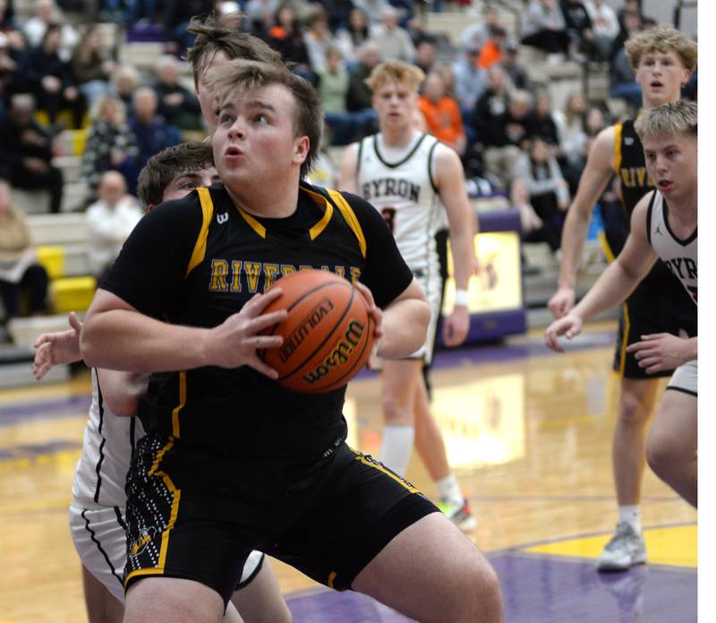 Riverdale's Dawson Peterson (44) makes a move to the basket as Cade Considine (33) defends at the 2A Mendota Sectional on Wednesday, Feb. 28, 2024 at Mendota High School.