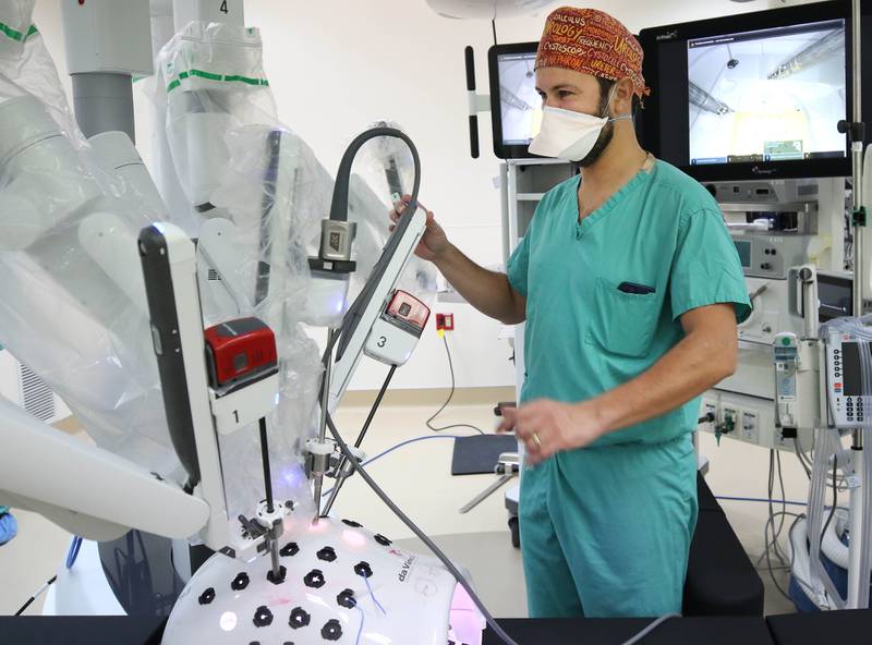 Dr. Ricardo Soares, who specializes in urologic oncology and endourology at Northwestern Medicine Kishwaukee Hospital, sets up the newly acquired surgical robot for a training session Tuesday, Oct. 18, 2022, at the hospital in DeKalb. The robot, which can be used for a variety of surgical procedures, will be put into use for the first time at the hospital this week.