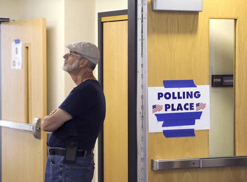 Voter Don Fontana, of Woodstock, waits for the polling location to open Friday, June 24, 2022, at the McHenry County Administration Building, 667 Ware Road in Woodstock. Voters are able to cast an early ballot until Monday and a regular ballot on Tuesday for the primary election.