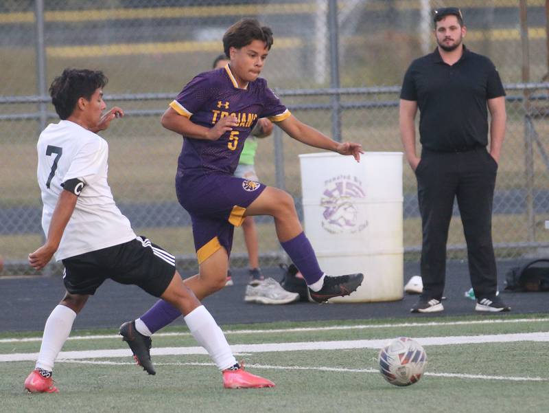 Mendota's Mauricio Salinas kicks the ball away from Kewanee's Michael Bermudez during the Three Rivers Tournament on Thursday, Oct. 2, 2025 at Mendota High School.