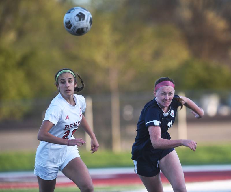 Benet's Ivana Vukas, left, and St. Viator's Molly Craig eye the loose ball during Tuesday’s girls soccer game in Arlington Heights.