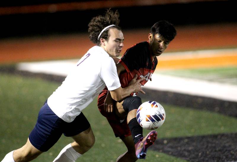 Conant’s Krystian Niziolek (7) goes after the ball ahead of Glenbard East’s David Hernandez during a 3A St. Charles East Sectional semifinal on Wednesday, Oct. 26, 2022.