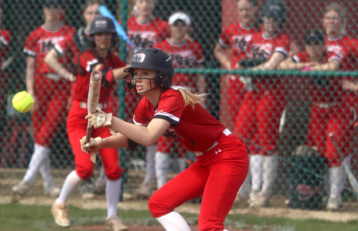 Huntley’s Clara Hudgens bunts for a single against St. Charles East during varsity softball at Marengo Saturday morning.