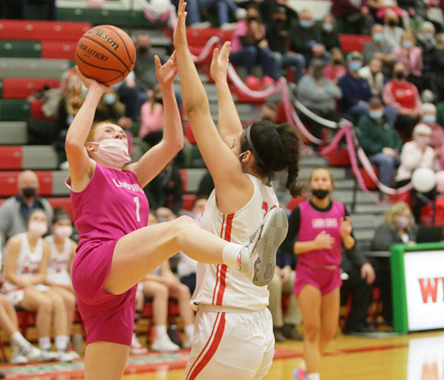 L-P's Addison Duttlinger, (1) attempts to shoot a shot over Ottawa's Cheyenne Joachim, (33) on Tuesday Feb. 1, 2022 at L-P.