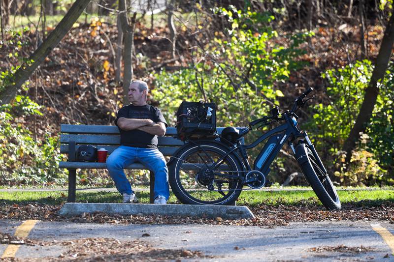 Dave Saenz, of New Lenox, stops to enjoy a quiet moment at Barr Park during his bike ride as temperatures reach high 70’s on Thursday, November 10th in Joliet.