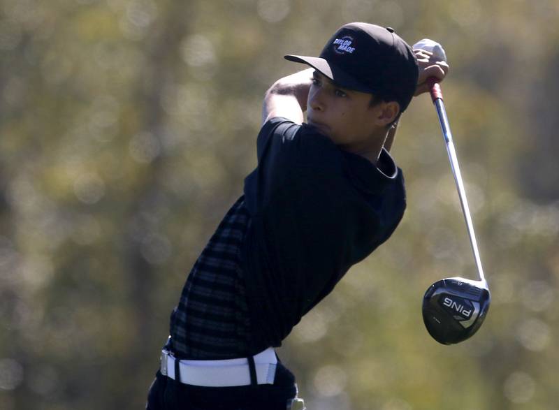 Huntley’s Austin Matich watches his tee shot in the ninth hole during the IHSA Class 3A Jacobs Sectional golf tournament on Monday, Oct. 7, 2024, at Randall Oaks Golf Club in West Dundee.