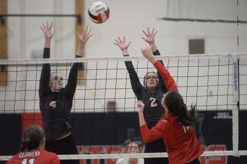 Fulton's Ava Bowen (4) and Brookyn Brennan (2) block during a Thursday, Sept. 21, 2023 match against Amboy at Fulton High School.