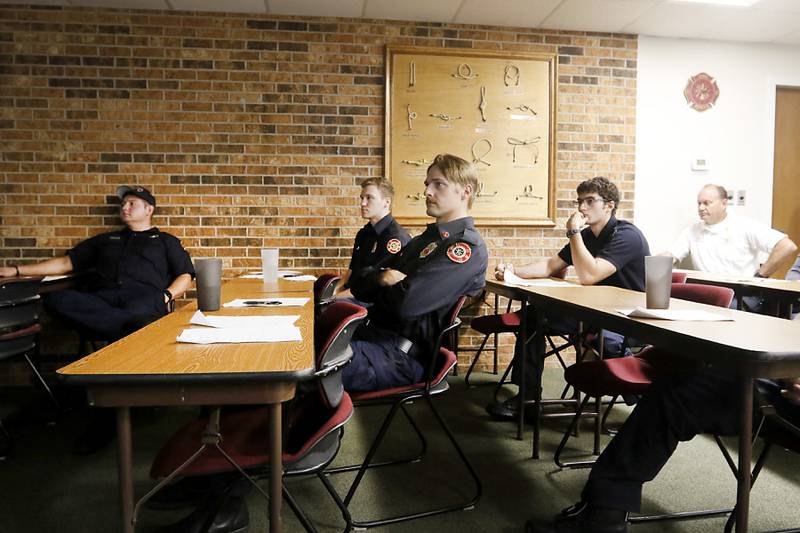 Spring Grove Fire Protection District firefighters and paramedics listen to a lecture during a training session Monday, Sept. 12, 2022, put on by Live4Lali on how to teach others to use naloxone in an overdose situation.
