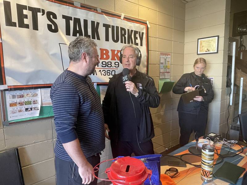 Sycamore Rotary Club president Brandon Diviak (left) and WLBK radio host TD Ryan speak Nov. 17, 2023 during a live broadcast from the DeKalb Salvation Army.