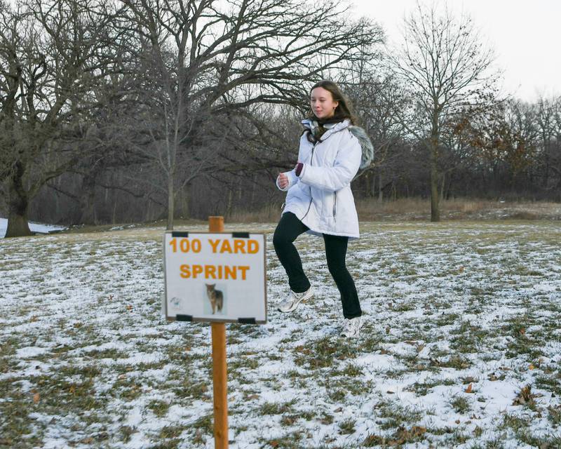 Mackenzie McGraw, 12, of Gilberts sees how fast she can do a 100-yard sprint compare to a coyote, part of Polar-Palooza on Saturday Jan. 17, 2026, at Creek Bend Nature Center in St. Charles.