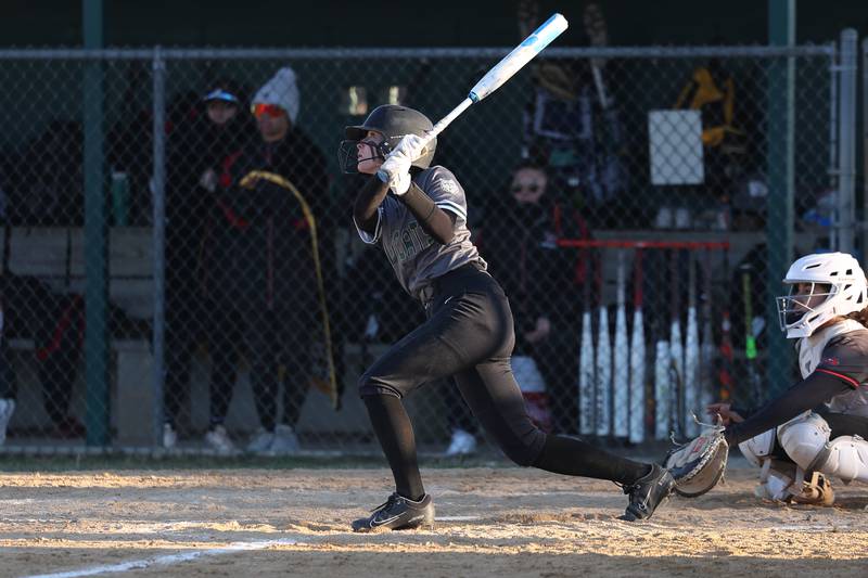 Plainfield Central’s Evalyn Prochaska connects for a two run triple against Bolingbrook on Wednesday, March 20, 2024.