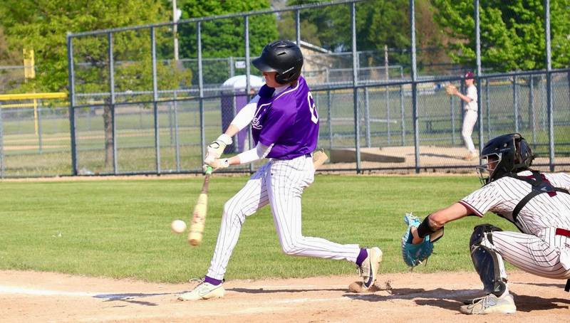 Rochelle's Bobby Tourdot lines a base hit to score a run during the Hubs' game with Marengo.
