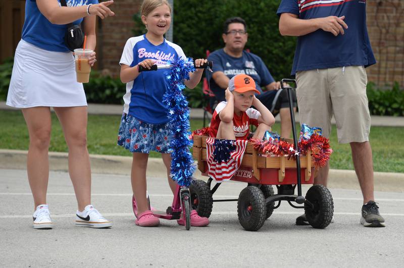 Children and families including Mia and Cooper Borkovec of Brookfield attend the Brookfield 4th of July parade  Friday July 4, 2025.