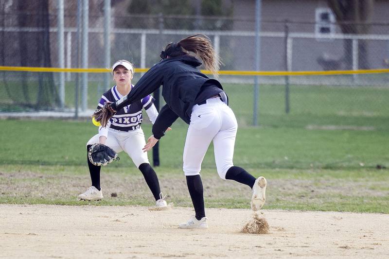 Dixon’s Kiley Gaither snags a pop-up against Genoa-Kingston Monday, April 7, 2025.