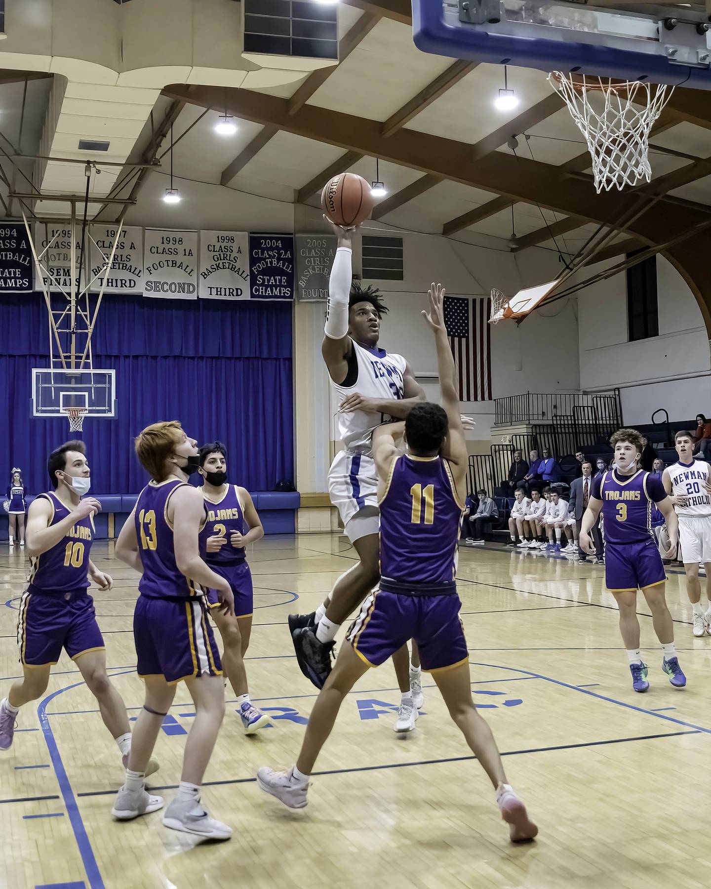 Newman's Marcus Williams shoots in the lane over Mendota's Rafael Romero (11) during their Three Rivers East game Friday night in Sterling.