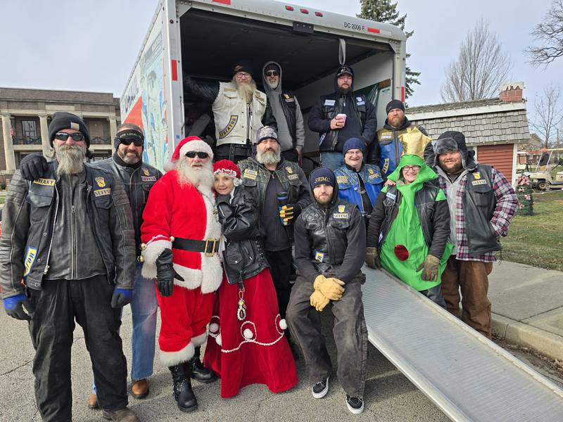 The Screaming Eagles Motorcycle Club poses for a group photo Saturday, Nov. 30, 2024, at the southwest corner of City Park during its annual toy collection drive. The motorcycle club collected toys and monetary donations for children in need to receive Christmas gifts.