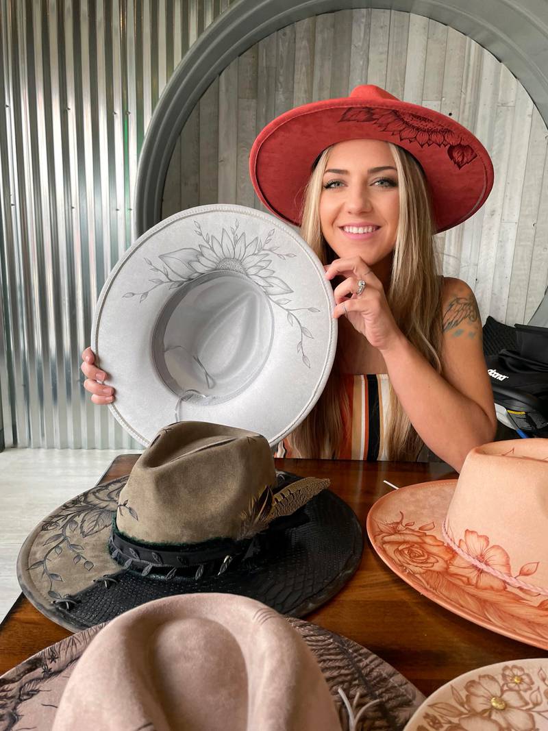 Lauren Sharp founded Art for Adrienne in honor of her late mother, Adrienne Paradise. Throughout the month of May, National Mental Health Awareness Month, Sharp will dedicate 10 percent of sales of her hand-etched hats to the National Alliance on Mental Illness of McHenry County, Illinois.