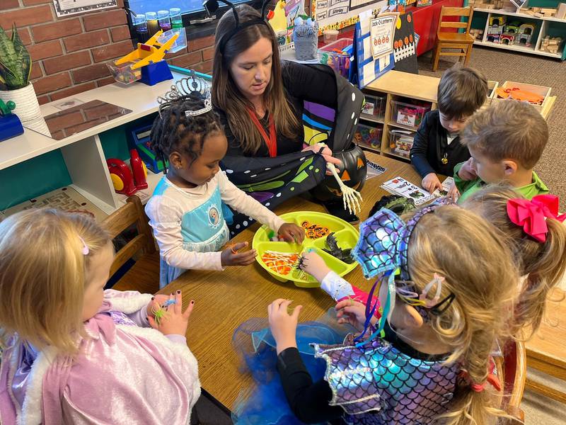 Students get hands-on learning during classroom activity time at Little Lambs Preschool of Immanuel Lutheran Church in DeKalb.