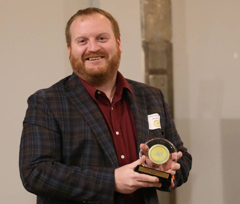 Corey VanSchaick, Chief Credit Officer, Spring Valley City Bank poses for a photo with his award during the Illinois Valley Chamber of Commerce 40 Under Forty Awards Gala on Thursday, Feb. 9, 2023 at Westclox in Peru.