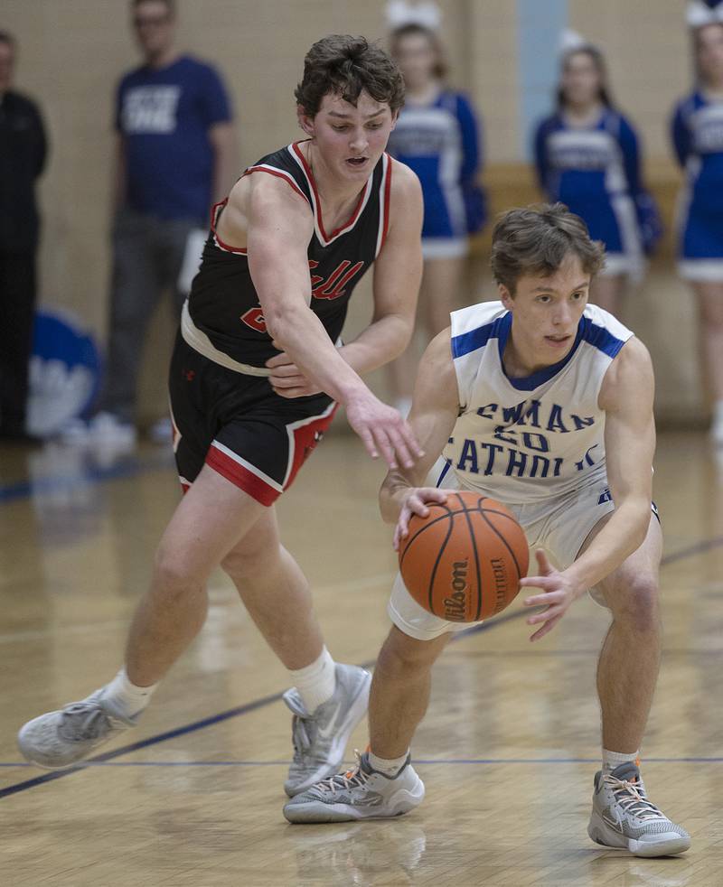 Hall’s Jack Jablonski goes for a steal against Newman’s Wyatt Widolff Friday, Feb. 2, 2024 at Newman High School.
