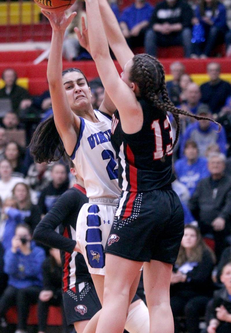 Geneva’s Leah Palmer (left) tries to shoot the ball past Barrington’s Maddie Ziebarth during the Class 4A Schaumburg Supersectional on Monday, Feb. 27, 2023.