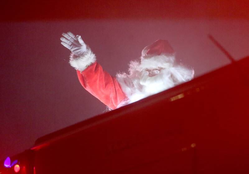 Santa Claus rides in a Utica Fire engine during the Utica Fire Department Santa parade on Saturday, Dec. 23, 2023. Santa took time out of his busy schedule to parade through most of the the Village of Utica bringing cheer to children of all ages. The Utica Fire Protection District has been hosting Santa since December 1941 and is one of the oldest Santa parades in the Illinois Valley. Each December, the Utica Fire Department escorts Santa throughout subdivisions and parades throughout the village.