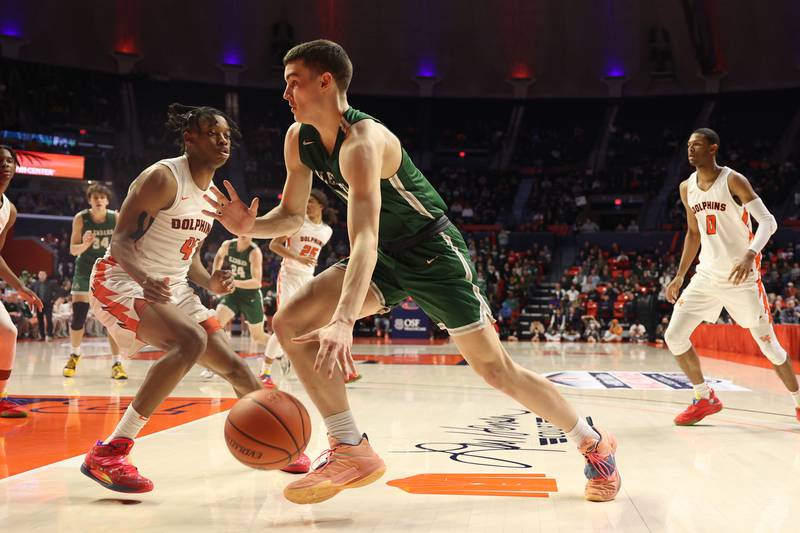 Glenbard West’s Ryan Renfro drives to the basket against Whitney Young in the Class 4A championship game at State Farm Center in Champaign. Saturday, Mar. 12, 2022, in Champaign.