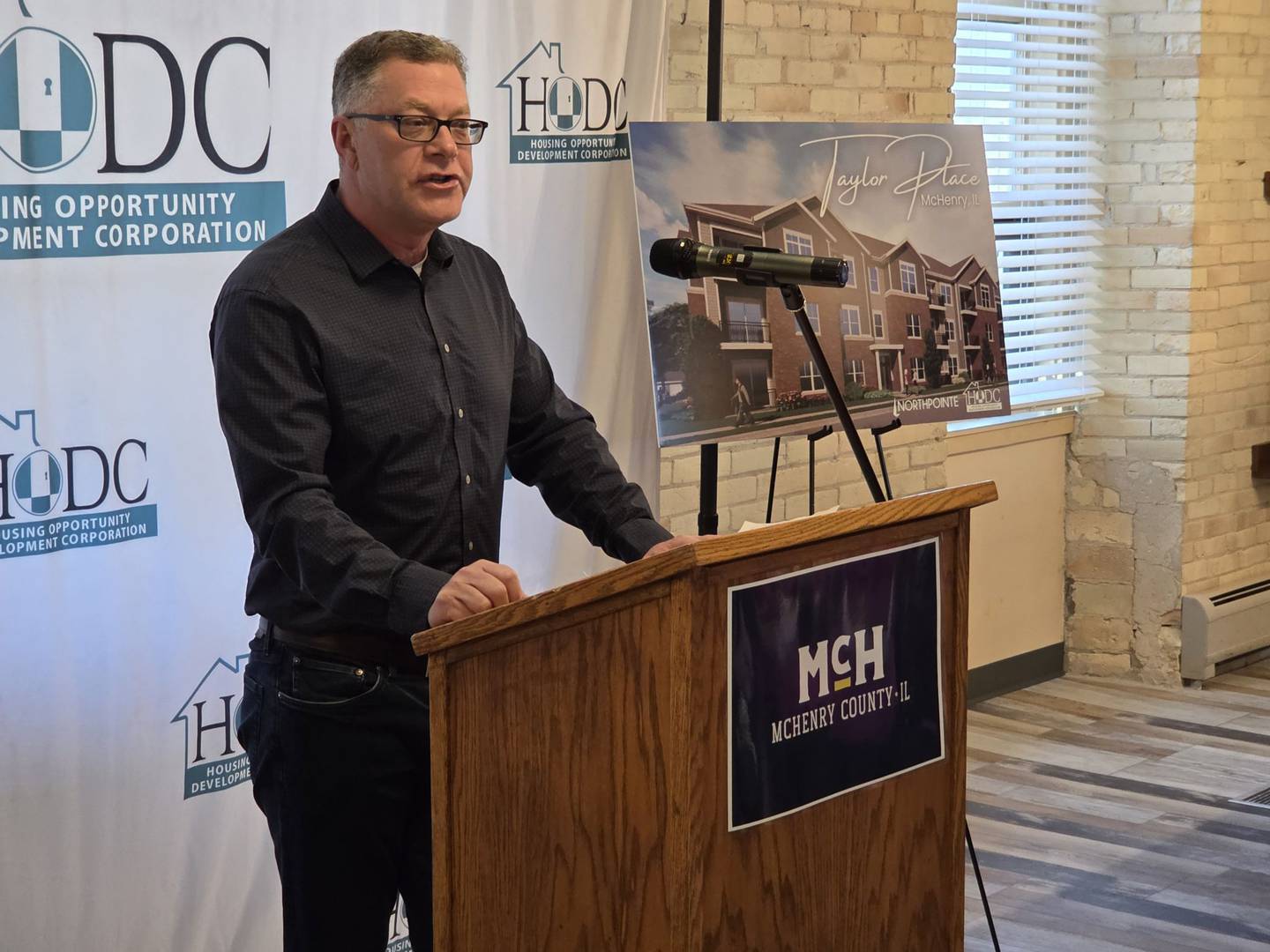 McHenry County Board Chairman Michael Buehler spoke on Wednesday, Feb. 25, 2026, during the grand opening of McHenry's Taylor Place Apartments.