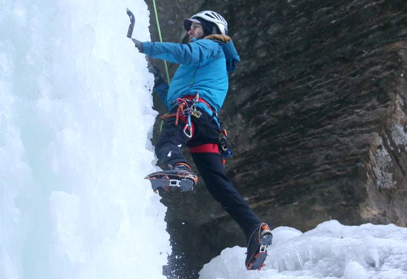 Jared Betcher climbs down an 80-foot frozen waterfall inside Wildcat Canyon on Friday, Jan. 24, 2025, at Starved Rock State Park. The waterfalls tend to freeze in January at Matthiessen and Starved Rock state parks. Climbers need to sign in and out at the front of the Park Maintenance Building across from the Visitor Center. Climbing is allowed only at four canyons at the park.