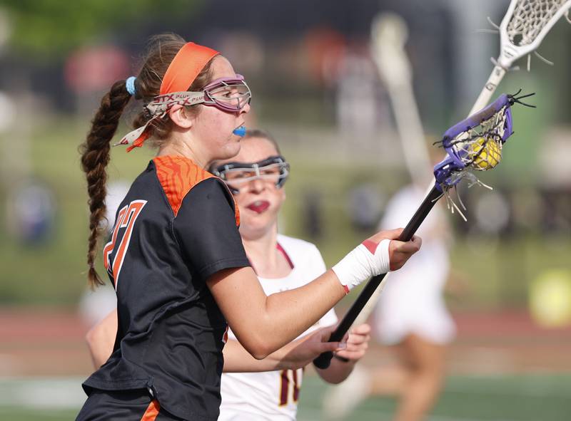 Crystal Lake Central Coop's Anna Star (27) runs down field during the lacrosse state semi-final match between Crystal Lake Central and Loyola Academy on Thursday, June 5, 2025 in Hinsdale.