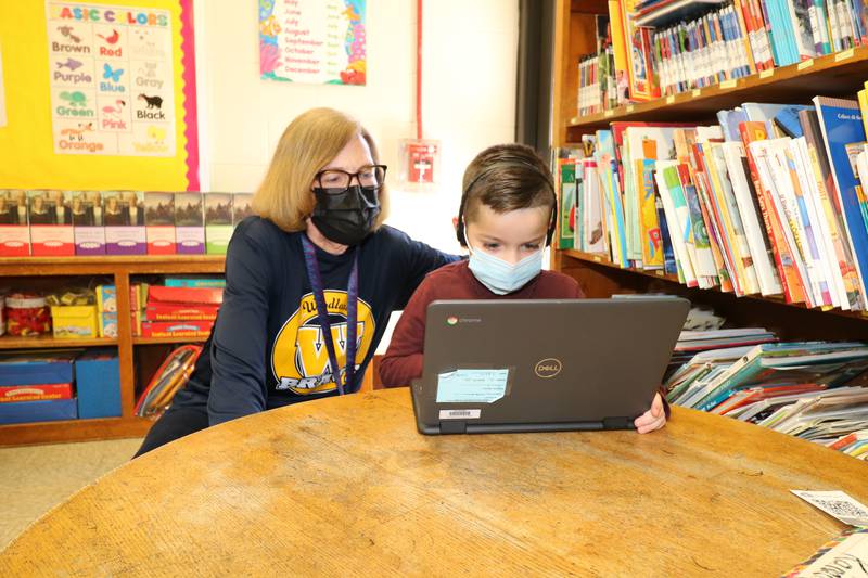 Sally Duris, a kindergarten teacher at Woodland Elementary School in Joliet, has worked more than 35 years at Joliet Public Schools District 86. Duris used to shy away from teaching kindergarten students; now, she loves it. Duris is seen working with kindergarten student Sebastian Orozco.
