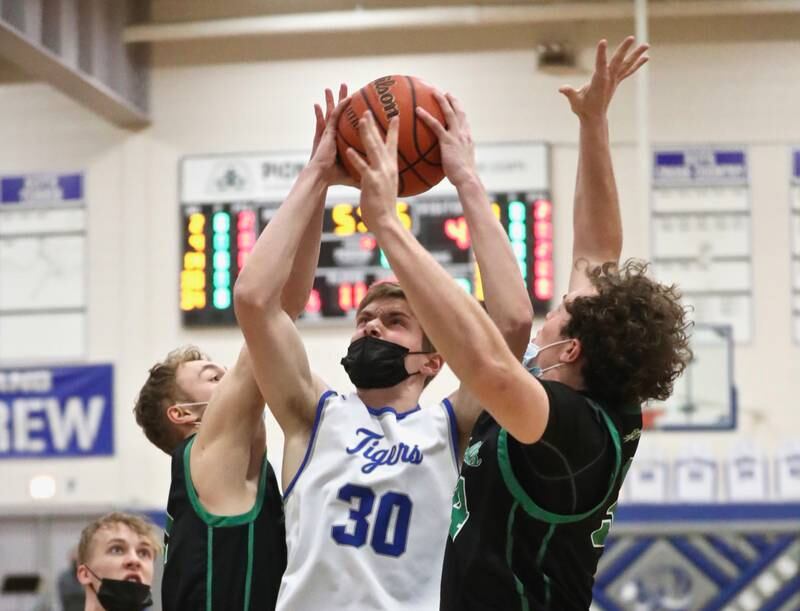 PHS senior Mack Williams stays focused for a shot in traffic against Rock Falls Saturday night at Prouty Gym.