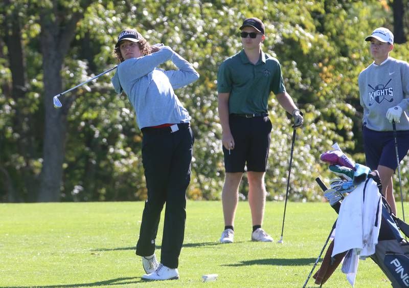 Henry-Senachwine's Jacob Miller tees off on the second hole as Midland's Ben Kovach and Fielcrest's Carter Senko watches during the Class 1A golf meet on Wednesday, Oct. 2, 2024 at Spring Creek Golf Course in Spring Valley.