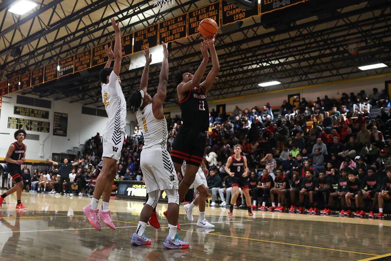Bolingbrook’s JT Pettigrew puts up a shot against Joliet West on Friday, Jan 24, 2025 in Joliet.