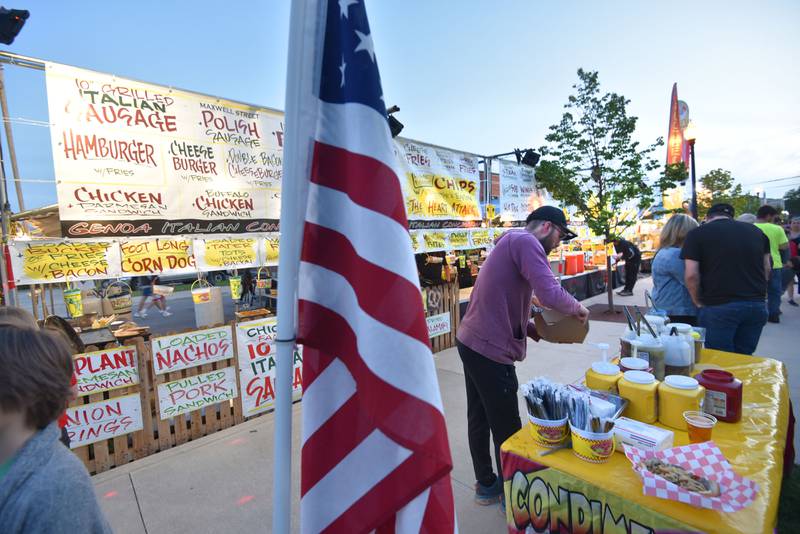 A line of concessions awaits those at the Cream of Wheaton summer festival in downtown Wheaton on Thursday, May 30, 2024.