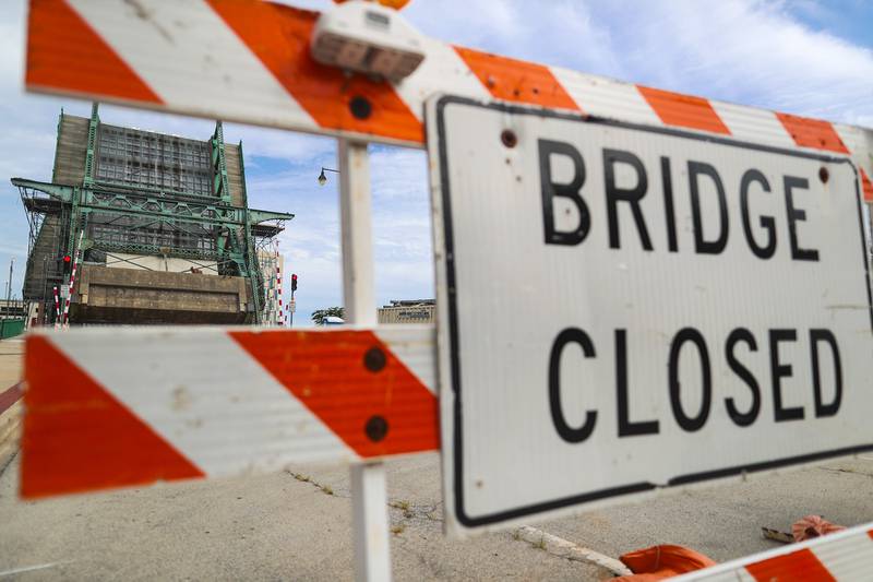 Road signs note the continued closure of the Jefferson Street Bridge on Monday, Aug. 23, 2021, in Joliet, Ill.