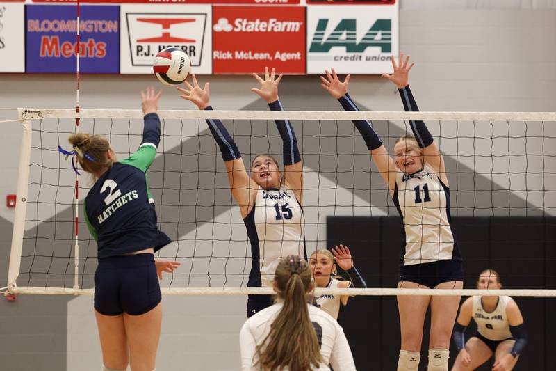Cissna Park's Ava Henrichs, center, and Sophie Duis jump to block a hit during the Timberwolves' victory in two sets, 25-22, 25-11, over Windsor/Stewardson-Strasburg in the IHSA Class 1A Heyworth Super-Sectional on Monday, Nov. 10, 2025.