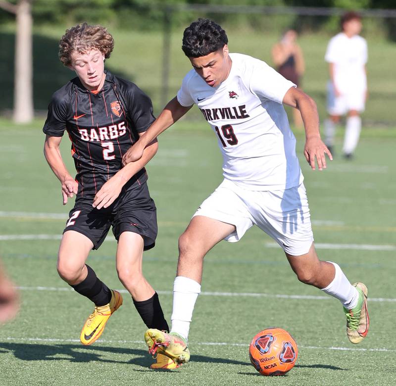 Yorkville's Bryan González holds off DeKalb's Jack Ager during their game Thursday, Aug. 25, 2022, in the Barb Cup at the Northern Illinois University Outdoor Recreation Sports Complex.