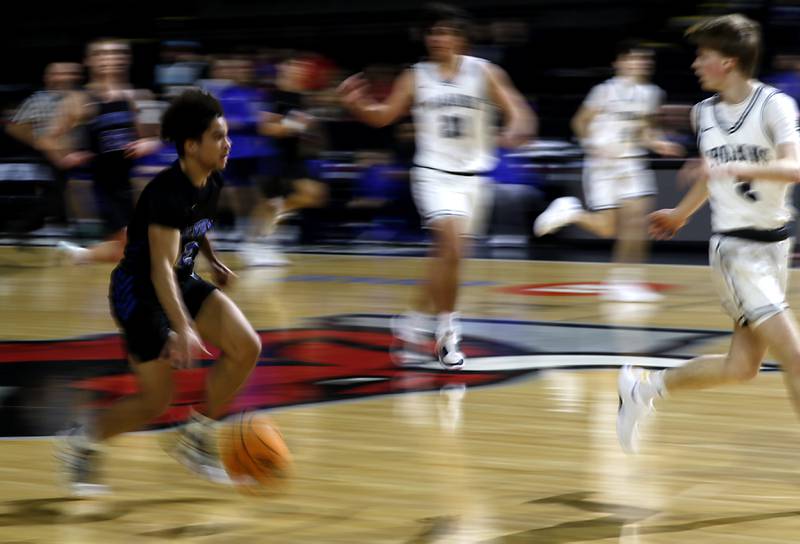 Burlington Central's Caden West brings the ball up the court during a Fox Valley Conference basketball game against Cary-Grove on Tuesday, Jan. 14, 2025, at Now Arena in Hoffman Estates.