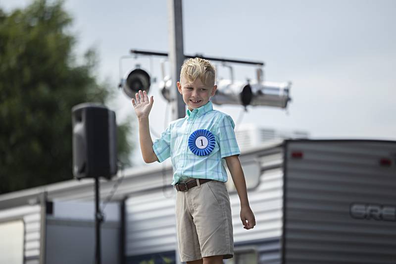 Cade Wiltfang waves from the stage Wednesday August 2, 2023 of the Little Mister Ogle County pageant.