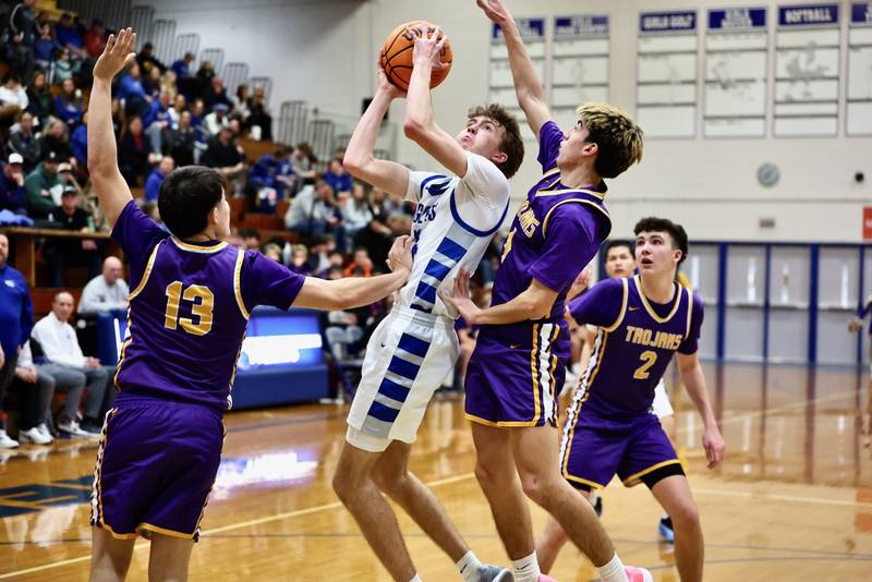 Princeton's Jackson Mason shoots over Mendota's Johan Cortez Friday night at Prouty Gym.