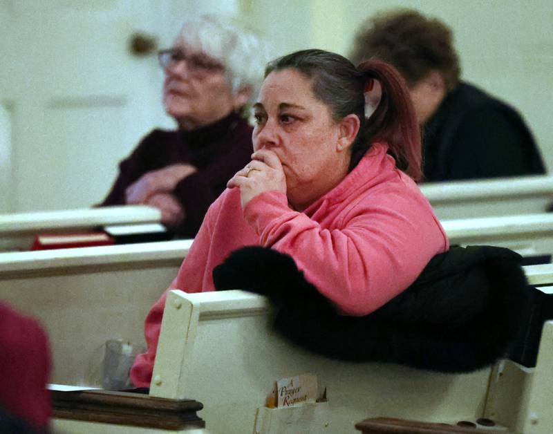 People listen to speakers Monday, Feb. 2, 2026, during the Vigil for Peace at the First Congregational United Church Of Christ in DeKalb. The vigil is being held in remembrance of those lost in recent ICE related shootings and to show solidarity with the people of Minnesota.