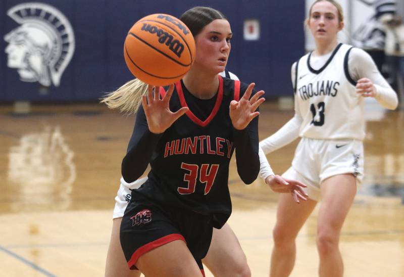 Huntley’s Ava McFadden dishes the ball in varsity girls basketball on Friday, Jan. 24, 2025, at Cary-Grove High School in Cary.